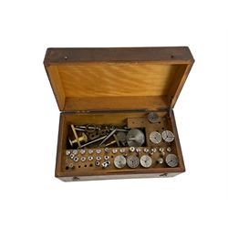 Boxed container set of assorted 6mm watchmakers lath collets with various ancillary fittings.