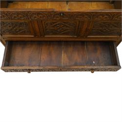 18th century carved oak coffer, rectangular hinged top over a lunette-carved frieze and tracery-style carved triple panelled front, the lower rail carved with repeating anthemion motifs, on square feet