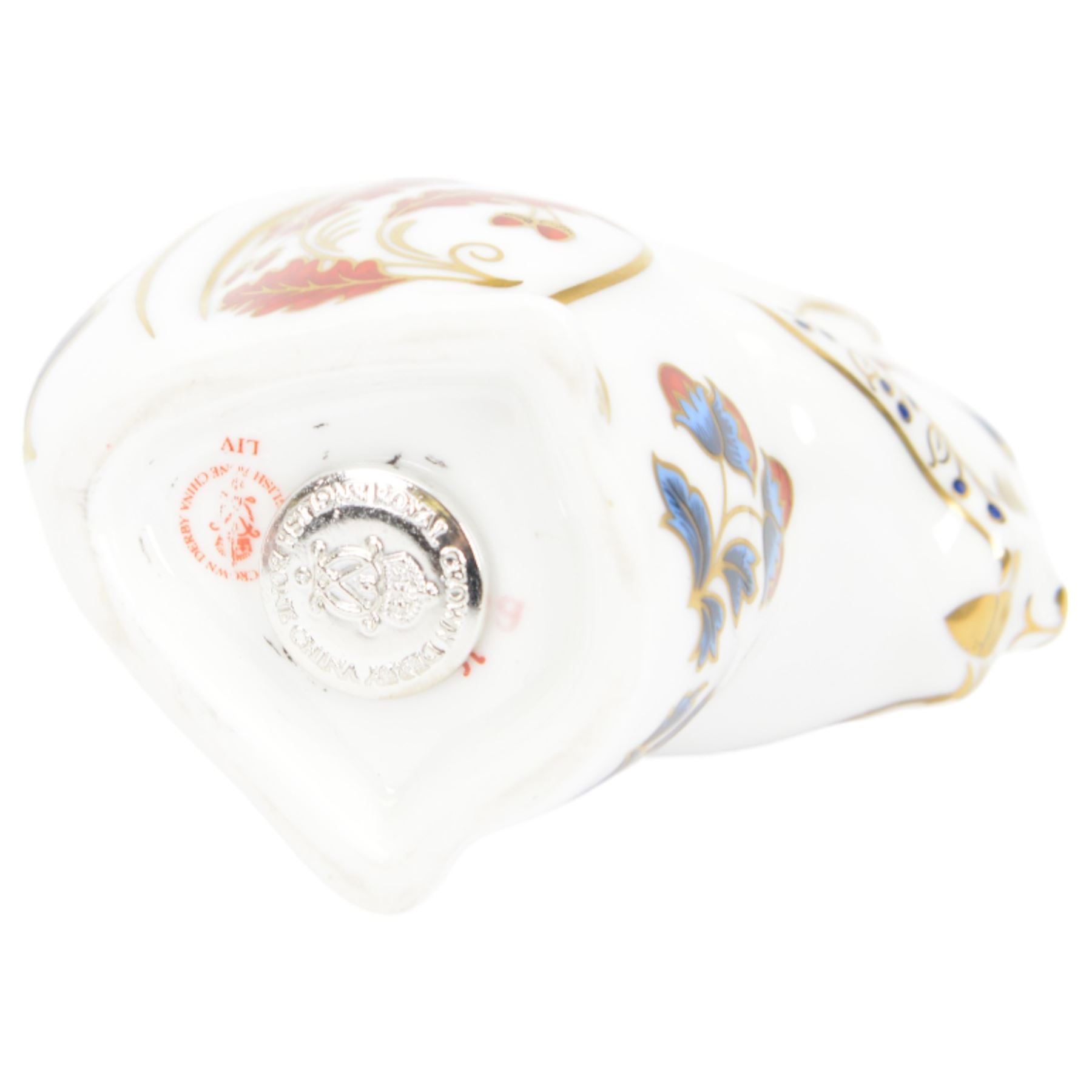 Four Royal Crown Derby paperweights, comprising Puffin, Squirrel, Badger, and Tiger Cub, each with silver stoppers