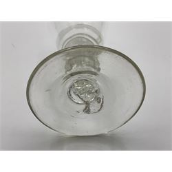 Group of 18th century drinking glasses, to include a small liquor glass with elongated funnel bowl with internal tear to 'stem', upon stepped foot, H9cm, an example with elongated funnel bowl and firing type foot, H10cm, two examples with folded feet, etc. (6)