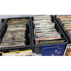 Seven boxes containing approximately eight hundred 45rpm singles, juke box singles and EPs, 1960s - 1990s including Beatles, Rolling Stones, Small Faces, Elvis Presley, The Animals, T-Rex, The Troggs, The Who, The Tremelloes, Cliff Richard and The Shadows, Queen, David Bowie, Whitesnake, Thomson Twins, Ultravox, Elton John, Phil Collins, Wham, George Michael, Blondie, Prince, Buddy Holly, Frankie Goes To Hollywood, Culture Club, Free, Donovan, Abba, Sonny and Cher, Peter Gabriel, Slade, Dusty Springfield etc; most in sleeves, some loose and some in plain card covers