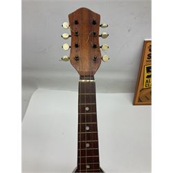 W.D. Keech banjolele pat.219720/23 with etched signature to the back; serial no.A12082 L55cm; and a restored Italian mandolin with segmented lute back; together with three music books