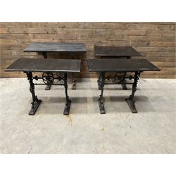 Four cast iron pub or bar tables with rectangular tops