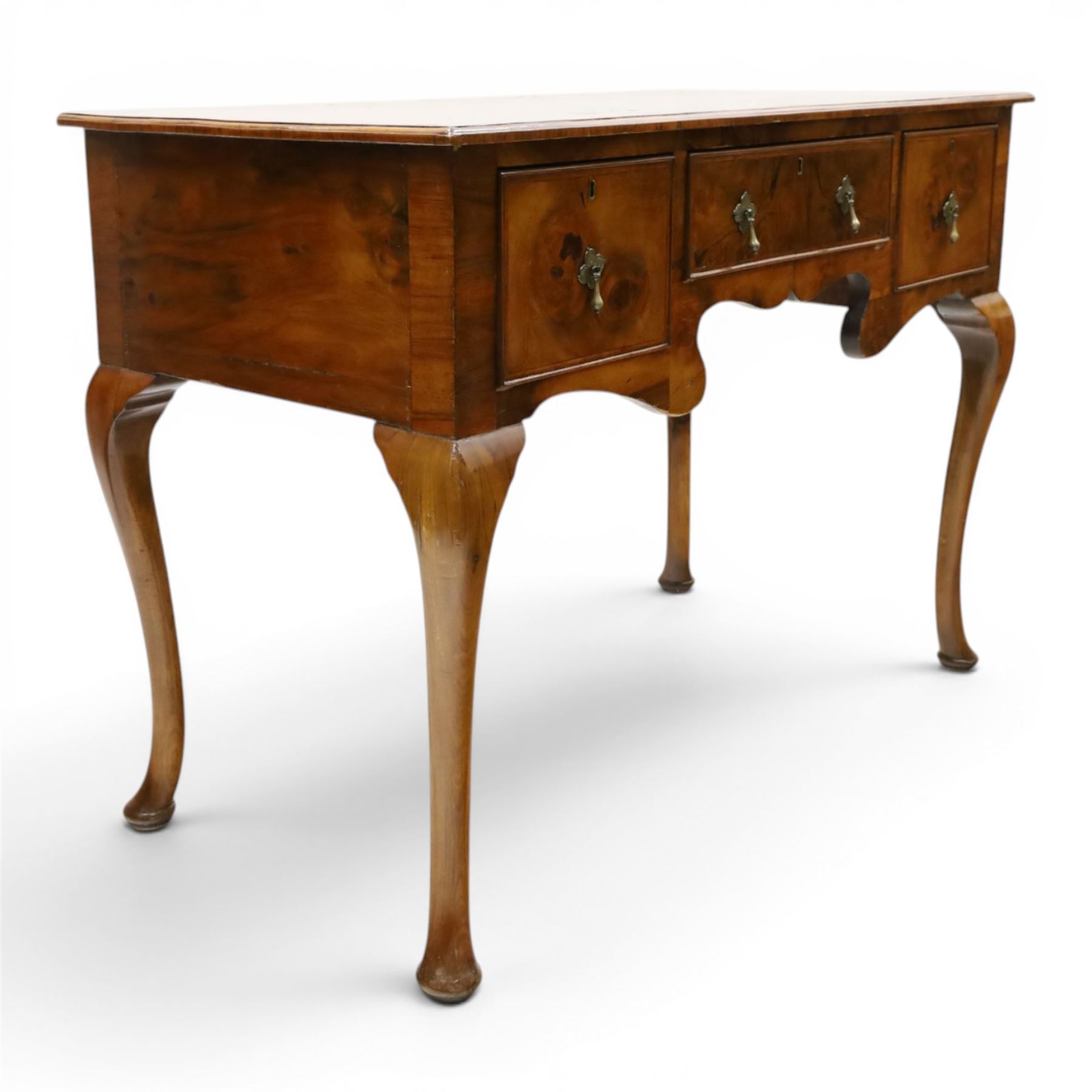 Queen Anne Design walnut kneehole desk with matching chair, rectangular figured top with crossbanding, three frieze drawers, raised on cabriole supports, the chair with serpentine front raised on cabriole supports