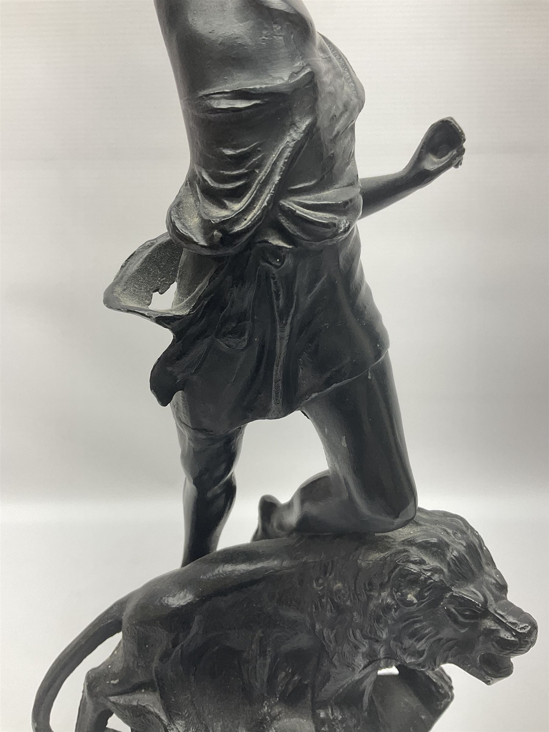 Pair of spelter figures, Le Force and Le Pouvoir, modeled as figures standing on lions, arms held aloft, H51cm 