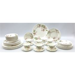 Wedgwood Apple Blossom pattern dinner and tea wares, comprising six dinner plates, six side plates, six bowls, nine smaller bowls, six tea cups and six saucers, milk jug and open sucrier. 