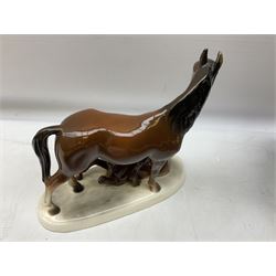 Royal Doulton bay horse figure, together with two similar examples on ceramic plinths and a quantity of collectors plates