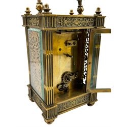 French - Matching pair of Edwardian 8-day timepiece carriage clocks with bevelled rectangular glass panels and overlaid friezes in gilt repousse work with fretted dial masks,  circular enamel chapter ring with Arabic numerals and steel spade hands, both clocks with single train movements, one movement with a jewelled cylinder platform escapement and the other with a jewelled and silvered lever platform escapement.
No Keys.