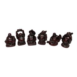 Six small figures modelled as buddhas 