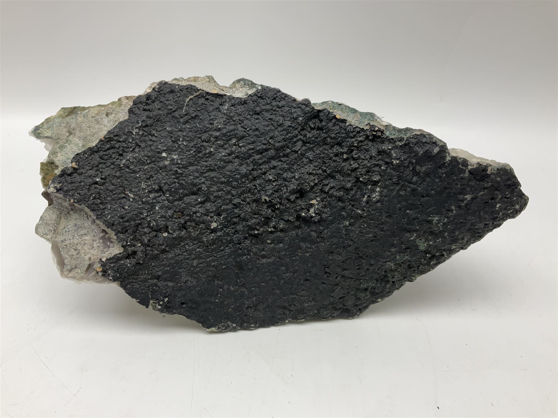 Amethyst crystal geode cluster, with well-defined crystals of various sizes, H10cm, L30cm