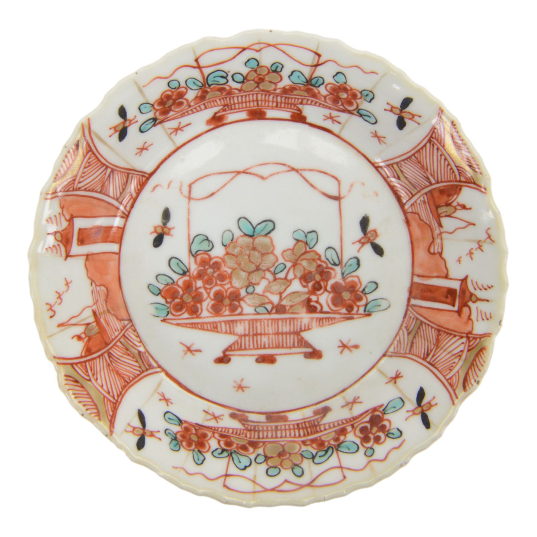 Amsterdam bont teapot, decorated with a basket of flowers, together with two Amsterdam bont saucers of similar design and five other saucers  