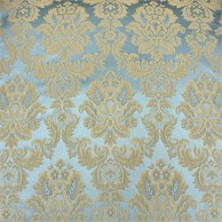 Georgian design carved walnut framed wingback armchair, upholstered in pale blue and gilt floral damask, with shaped loose seat cushion and rolled arms, raised on scallop and cartouche carved front cabriole supports terminating to pad feet