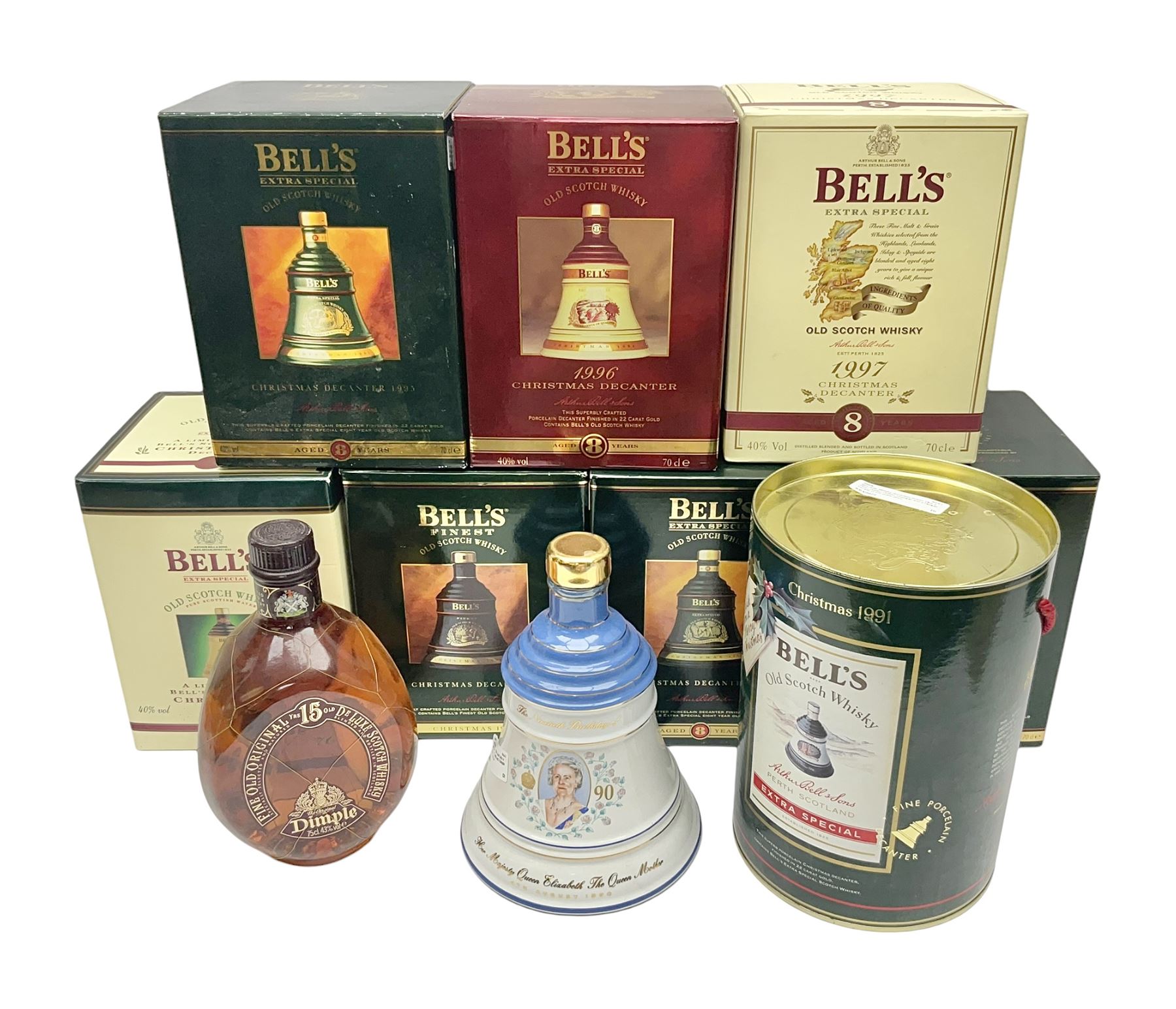 Dimple 15 Year Old Blended Scotch Whisky, together with nine Bells, scotch whisky, in Wade ceramic decanters, including Christmas 1991, 1998, 1996 etc, of various contents and proof 