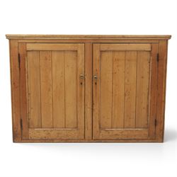 Victorian waxed pine low cupboard, fitted with two panelled doors and panelled sides, two interior shelves