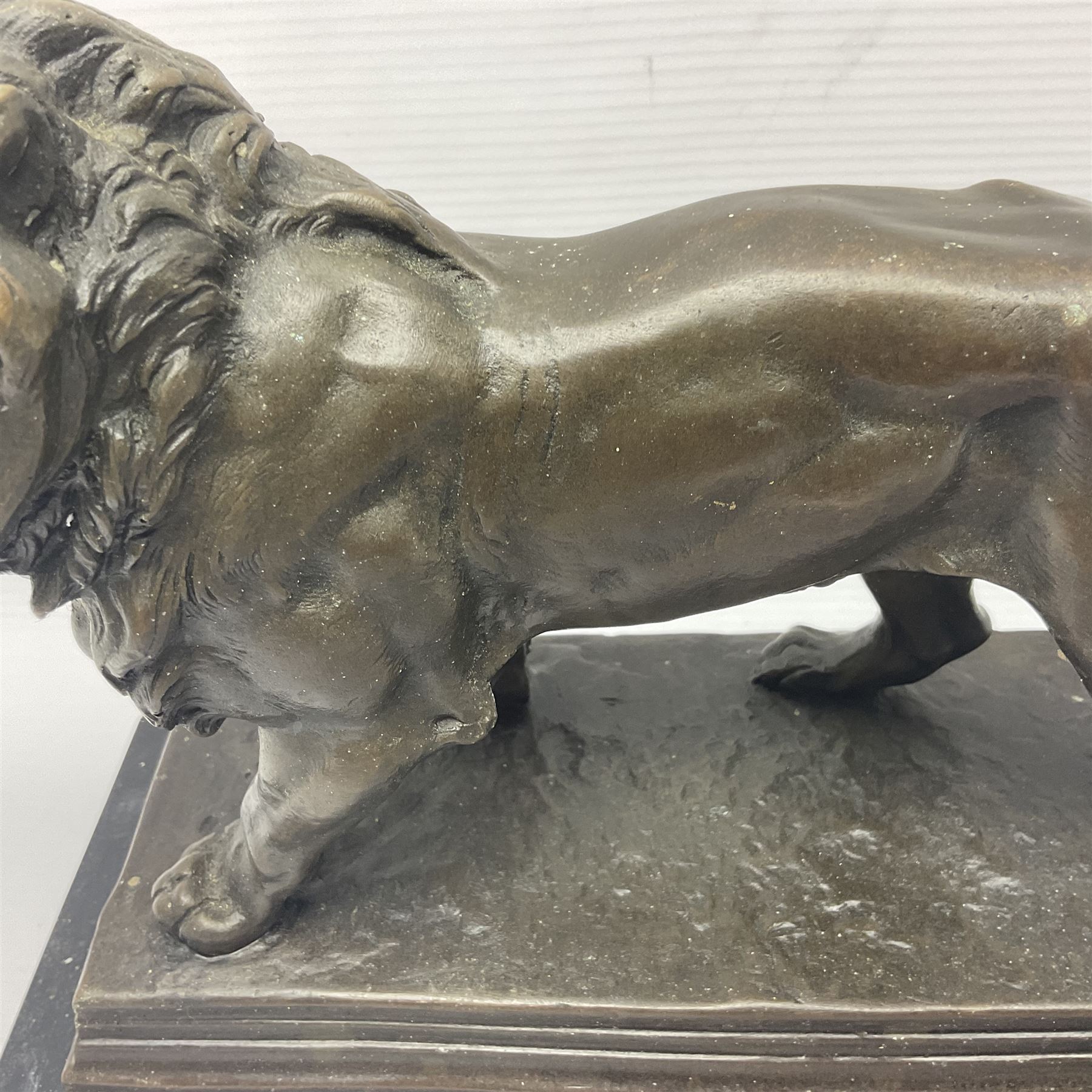 After Charles Valton, bronze, modelled as a lion, upon bronze plinth signed C H Valton, with foundry seal for J B Deposee, and black marble plinth base, overall H20cm L26cm