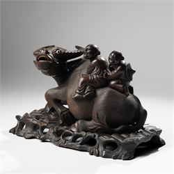 Early 20th century Chinese carved hardwood figural group of two boys on the back of a water buffalo on wooden stand W37cm