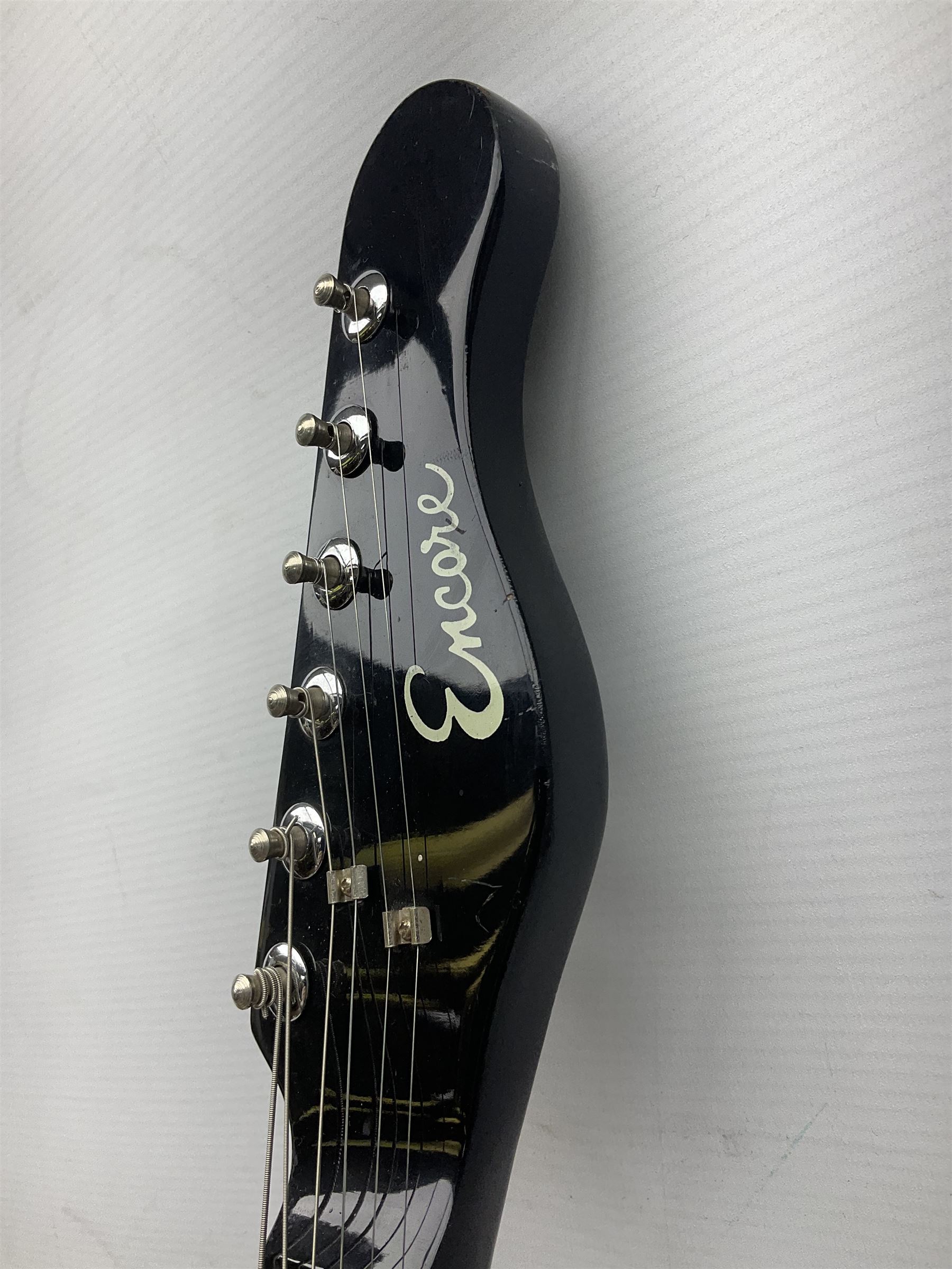 Encore black electric cut-away guitar L96cm; and Spanish Victor Garcia model 187 acoustic guitar, bears label dated 1972 L99cm; each in soft carrying case (2)