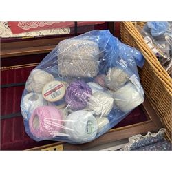 Collection of lace making wooden bobbins, together with lace making books and a handmade storage box