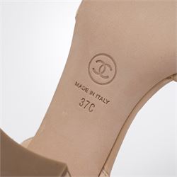 Chanel - pair of beige quilted leather heeled sandals, circa 2016, with stitched diamond pattern uppers, ankle straps with gold tone CC logo detail and hardware, with quilted block heels, size 37C, unused with original dust bags
