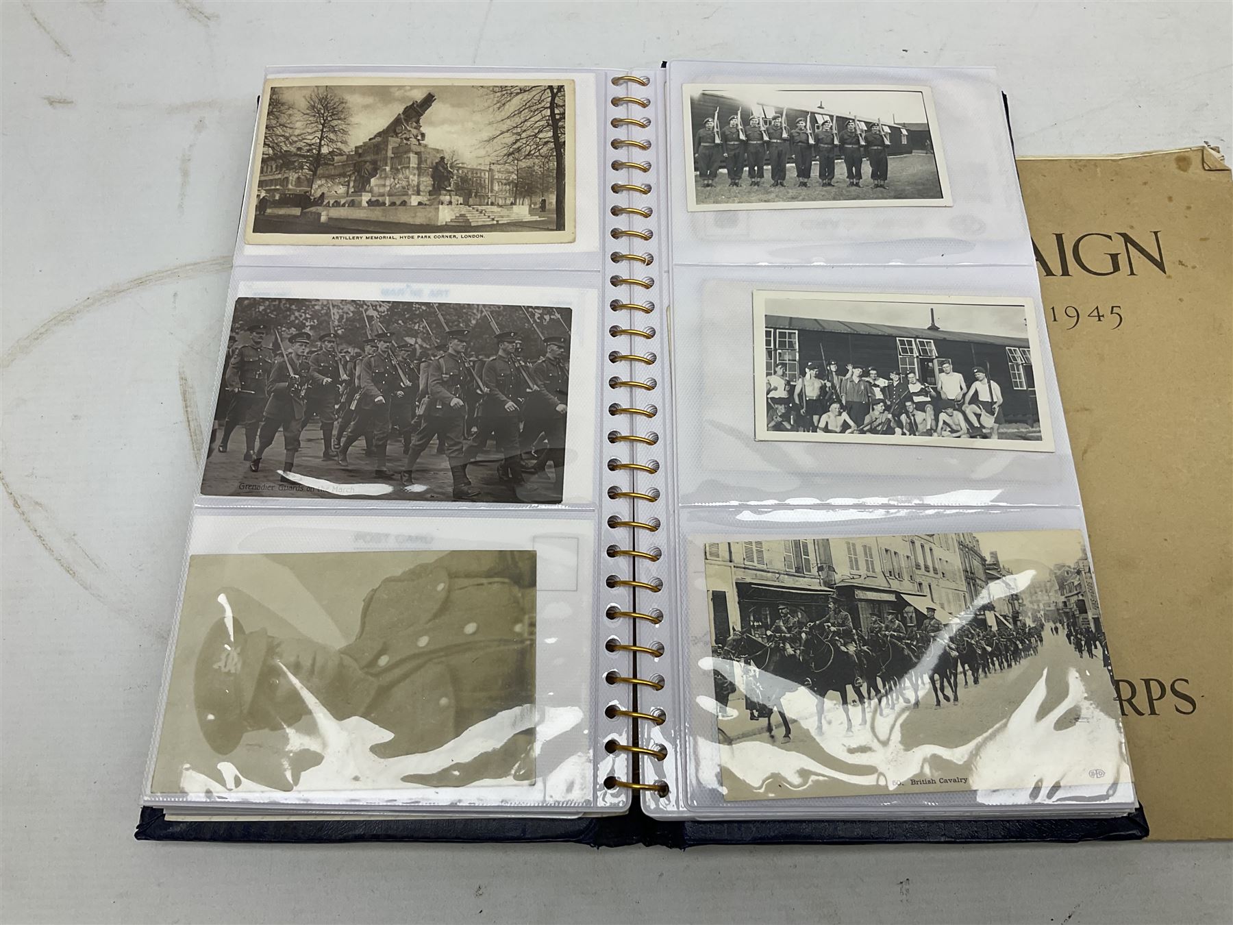 Modern album containing over sixty postcards and photographs including memorial portraits of KIA soldiers, regimental crests, comic, WW1 embroidered silk, uniforms, cap badges, camp and manoeuvre images etc; another personal photograph album of WW2 soldiers relaxing; Royal Armoured Corps booklet 'The Italian Campaign 3rd Sep. 1943 - 2nd May 1945; and other paper ephemera of military interest
