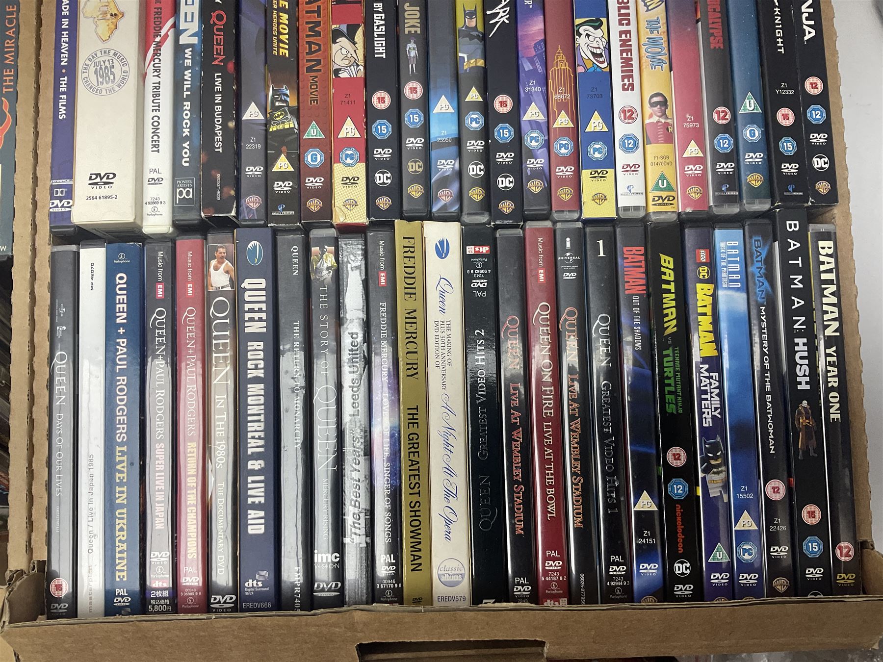 Large collection of VHS tapes, DVDS, CDs to include Queen, James Bond 007, Batman etc, in three boxes