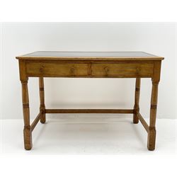 Late 20th century oak writing table desk, rectangular top with inset black leather top above two drawers, turned supports joined by stretchers