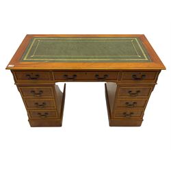 Yew wood twin pedestal office desk, fitted with nine drawers, inset leather writing surface