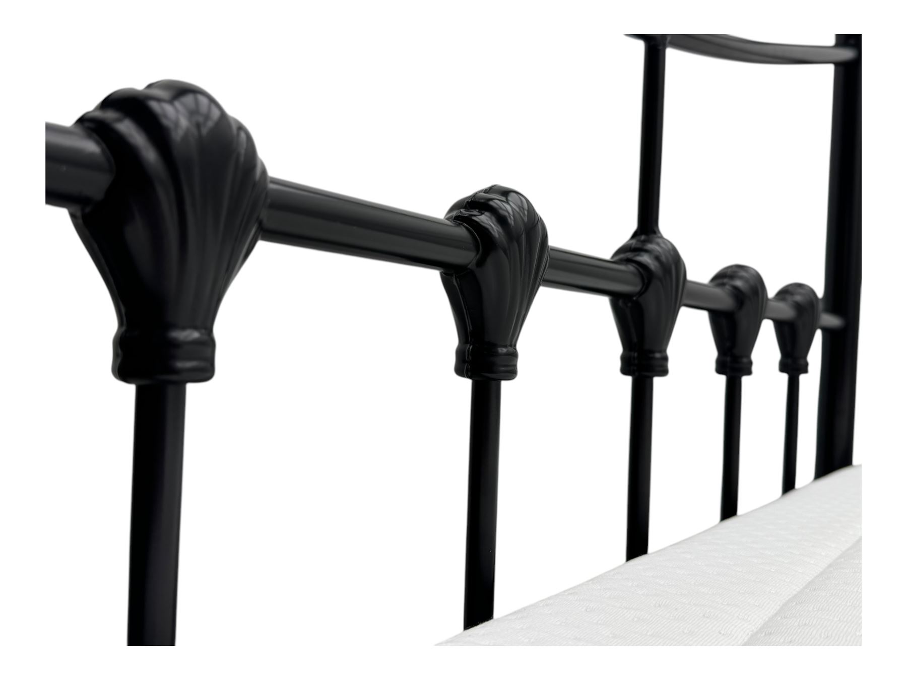 Contemporary Victorian revival black metal day bed, featuring arched back and sides with turned finials and spindle rails, complete with single 'OTTO' mattress