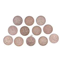 Twelve King George 1935 'Rocking Horse' silver one crown coins