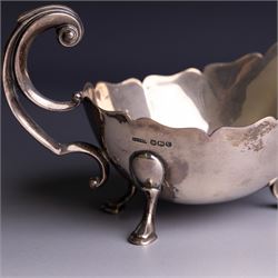 1930s silver sauceboat, of typical form with shaped rim and flying C scroll handle, upon three stepped feet, hallmarked Collingwood & Sons Ltd, Sheffield 1938