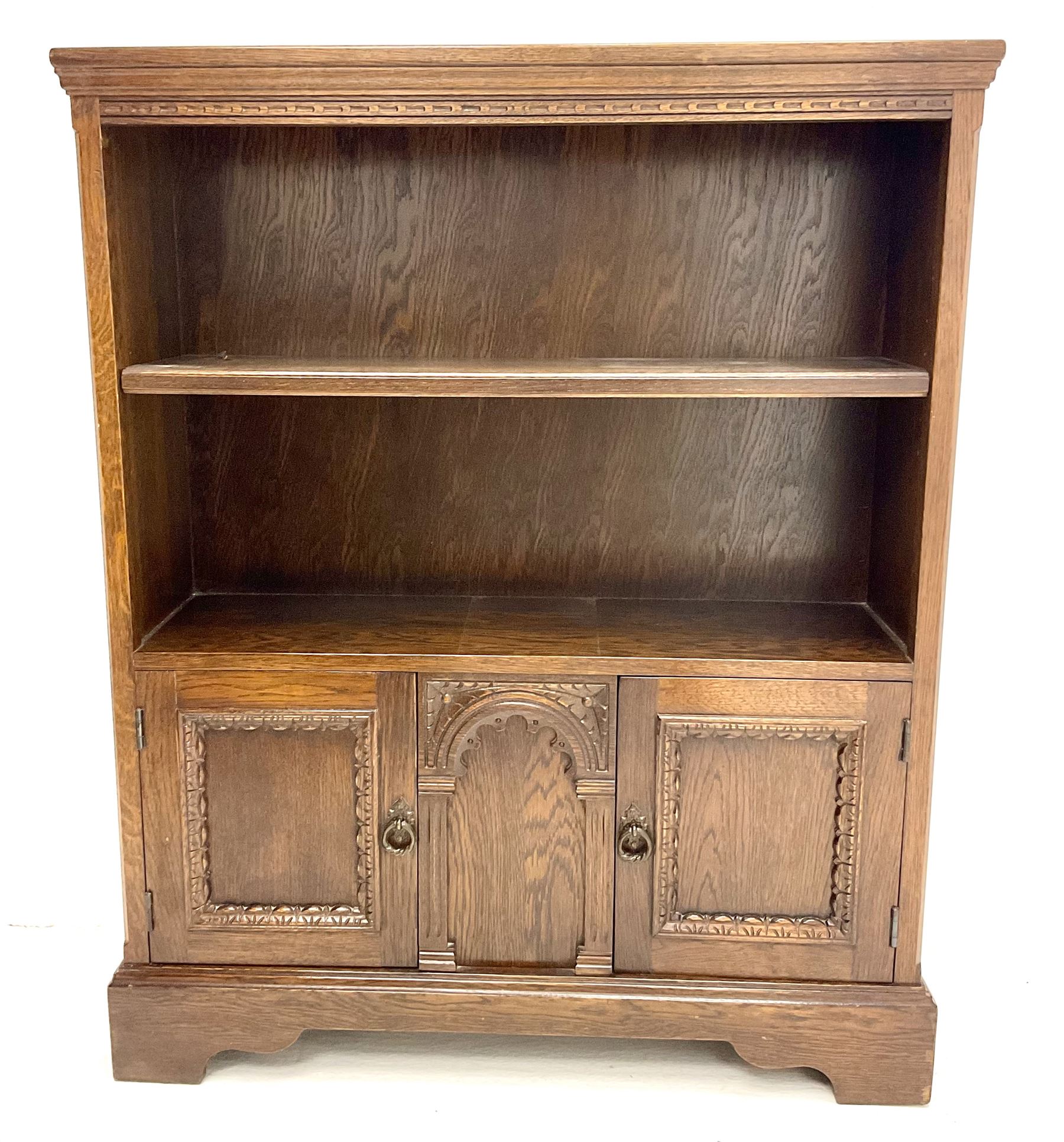 Mid 20th century oak open bookcase, single shelf above two base