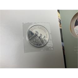 Seven Queen Elizabeth II United Kingdom five pound coins, including 2006 and 2007 in card folders, etc. 