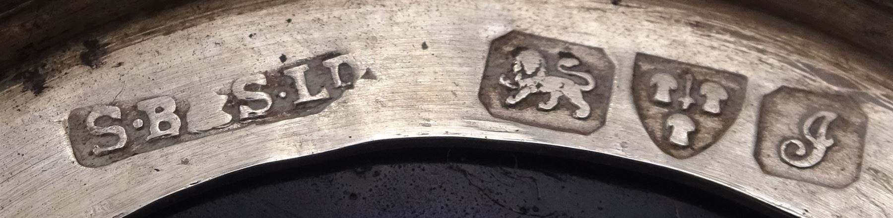 Group of early 20th century silver, to include a pair of specimen vases, of plain trumpet form, upon knopped stem and filled stepped circular foot, hallmarked J & R Griffin, Chester 1915, pair of silver mounted dwarf candlesticks, hallmarked J & R Griffin, Chester 1909, small silver mounted capstan inkwell with glass insert, hallmarked Chester 1909, maker's mark worn and indistinct, silver pepper, with pierced decoration, hallmarked S Blanckensee & Son Ltd, Birmingham 1909 and a similar mustard pot and cover, hallmarked S Blanckensee & Son Ltd, Chester 1909, both with blue glass liners