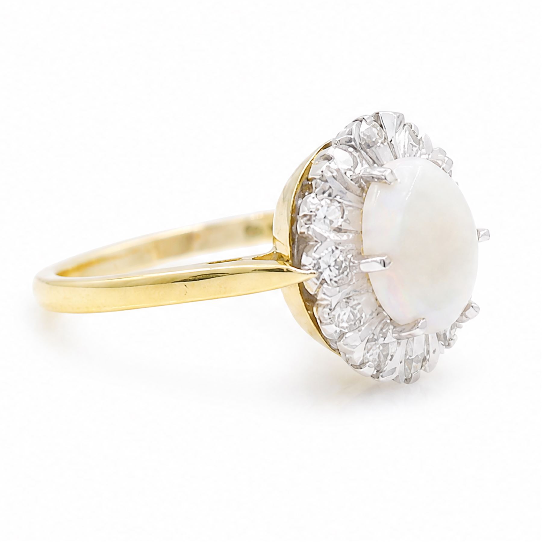 18ct gold opal and diamond cluster ring, oval cabochon cut opal surrounded by twelve single cut diamonds, London 1988