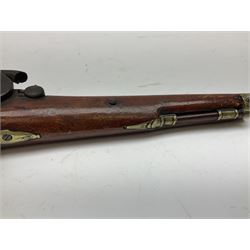 Re-manufactured percussion converted from flintlock single barrel pistol, the 20cm barrel with ramrod under, reused back action lock, brass furniture and hardwood stock L41cm overall