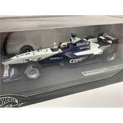 Five Mattel Hot Wheels 1:18 scale die-cast racing cars - Ferrari F1-2000 Michael Schumacher; Ferrari F-2002 Michael Schumacher; Jordan E-110 Heinz-Harald Frentzen; Williams F1 Team FW23Juan Pablo Montoya; and Ferrari F2001 Rubens Barrichello; all boxed (5)