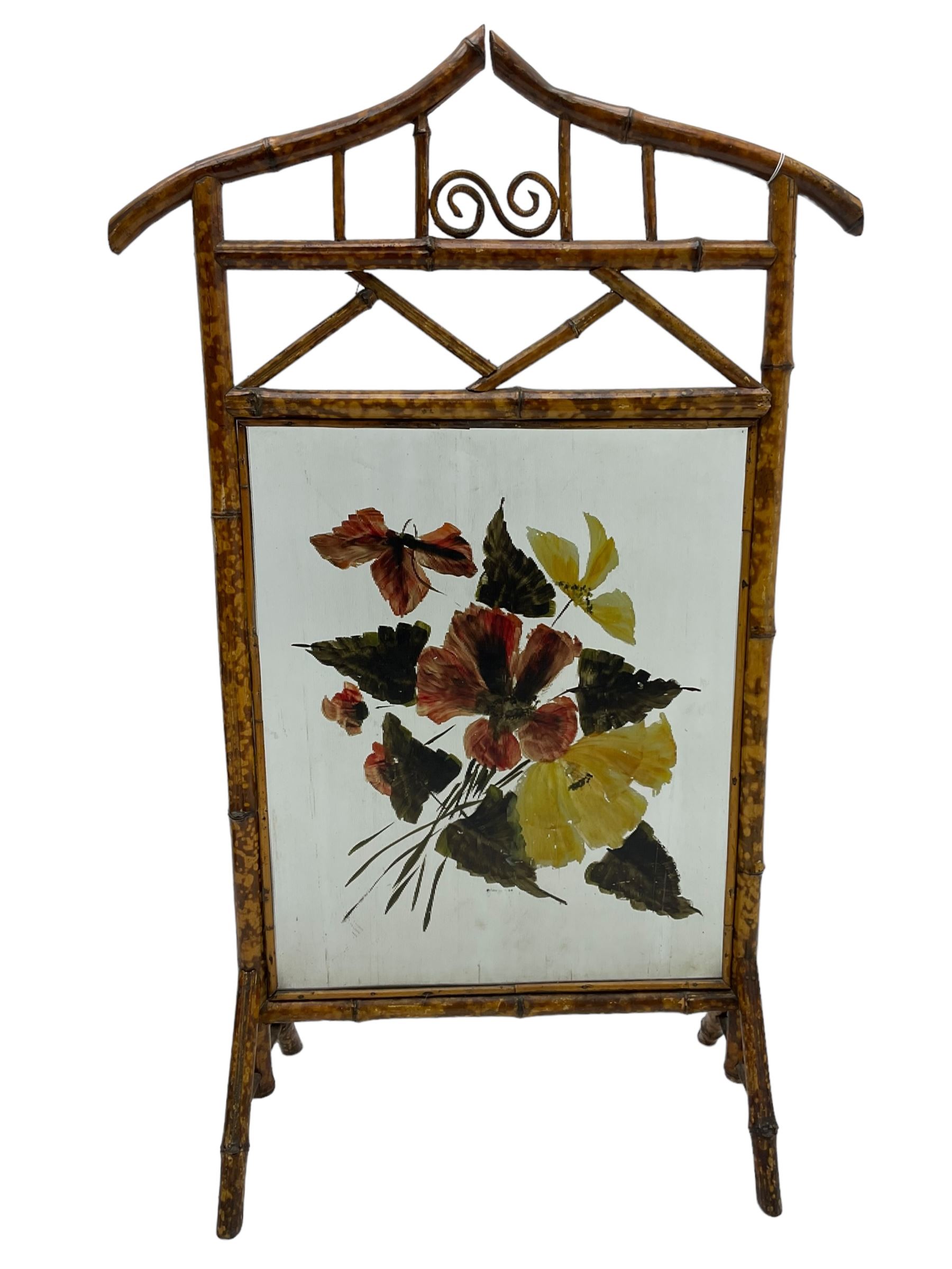 Victorian bamboo fire screen, pointed arched cresting rails over floral painted glass panel 
