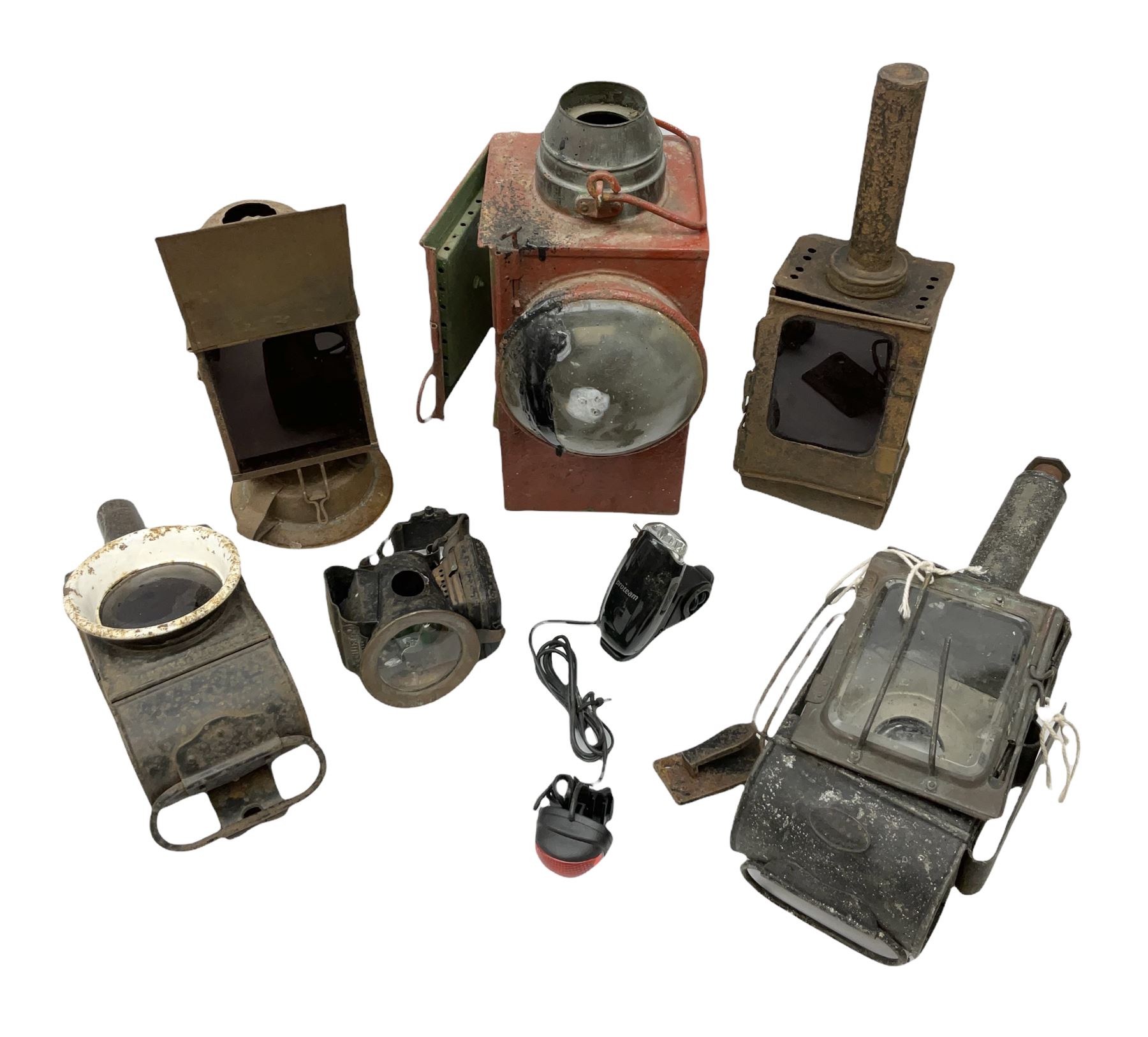 Collection of cast iron lamps, predominantly railway and coach examples, to include John Phillips Light of London Lamp Co coach lamp and Lito bicycle lamp by Miller & Co of Birmingham, etc
