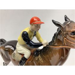 Beswick jockey on walking horse no 1037, in black white and yellow jockey colours, with printed mark beneath, H22cm