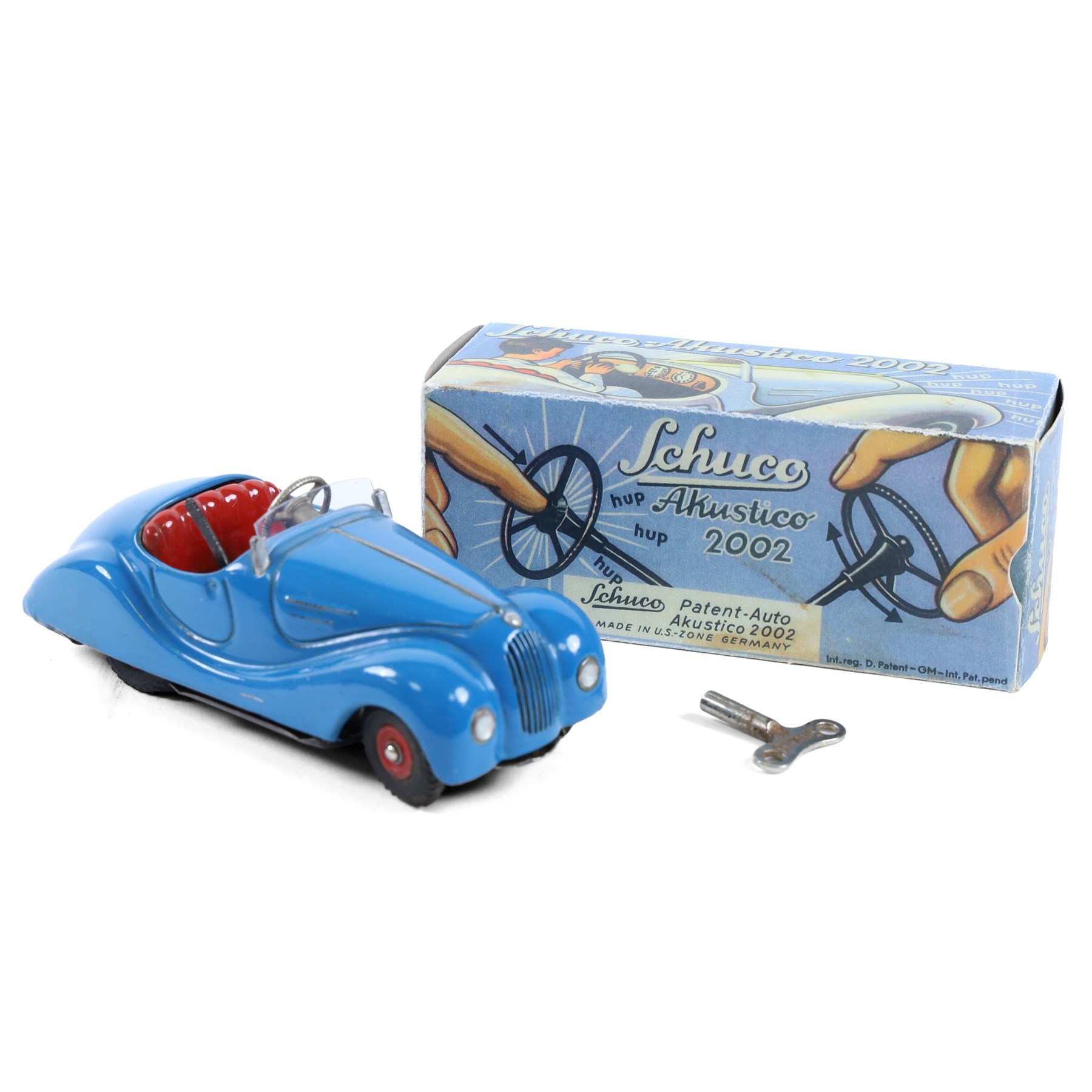 Schuco Akustico 2002 tinplate clockwork car, in blue with red interior, with key, boxed