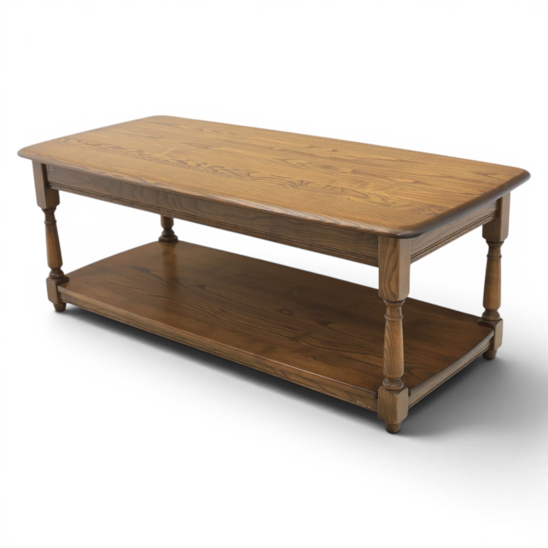 Ercol -  dark elm corner TV stand and coffee table, TV stand with drop triangular leaf, over open recess above a single drawer (H 47cm, D 44cm with leaf 79cm, W 73cm,  the coffee table with chamfered rectangular top with full length undertier, raised on turned supports (H 43cm, D 54cm, W 115cm) 