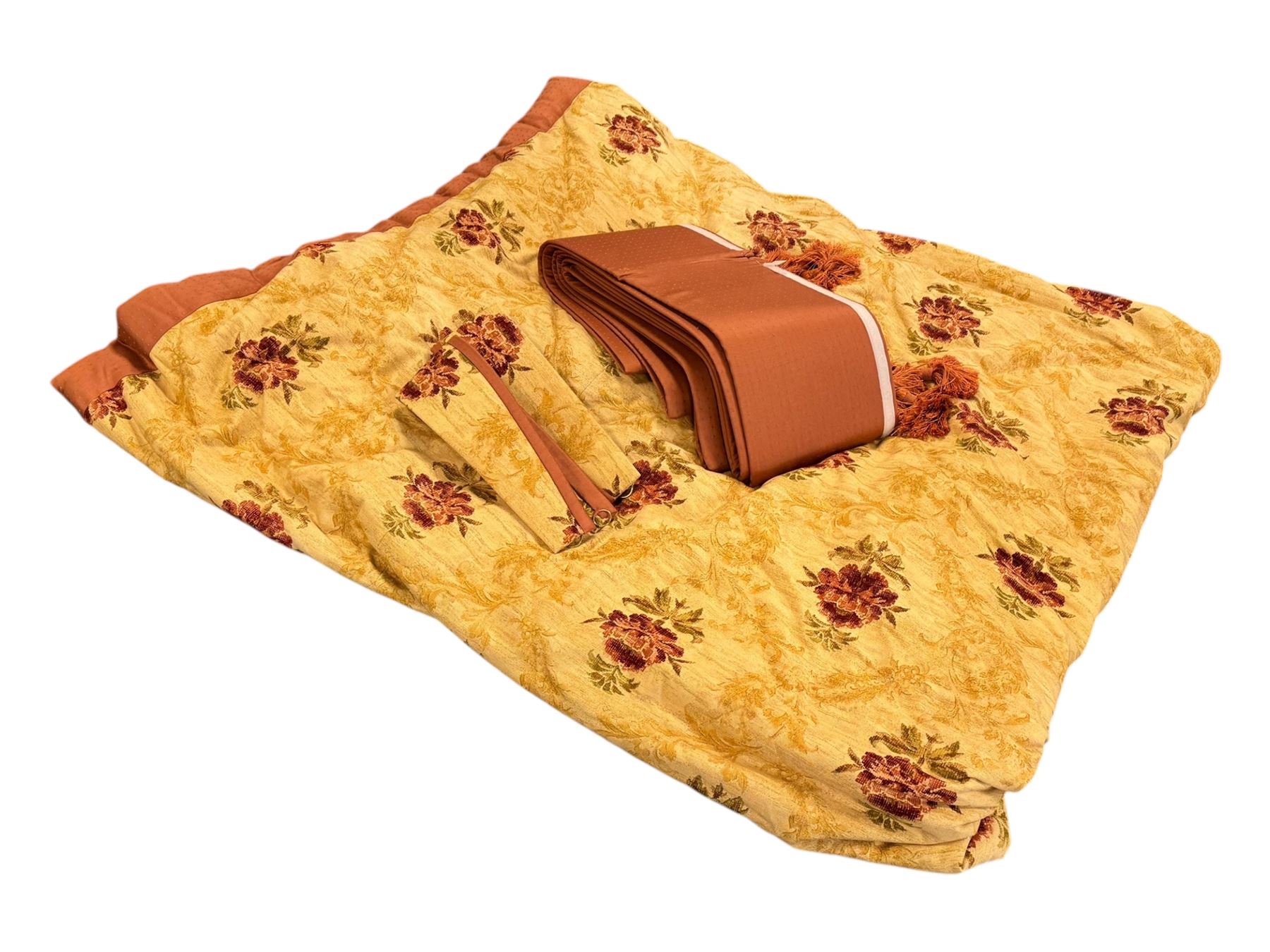 Mid-20th century quilted bedspread and matching valance, the bedspread displaying a warm gold floral pattern with burgundy highlights, complemented by a terracotta fabric trim, together with coordinating terracotta valance with tassels