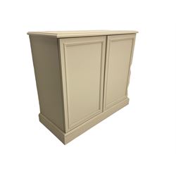 Off-white painted filing cabinet/cupboard, enclosed by two doors, plinth base