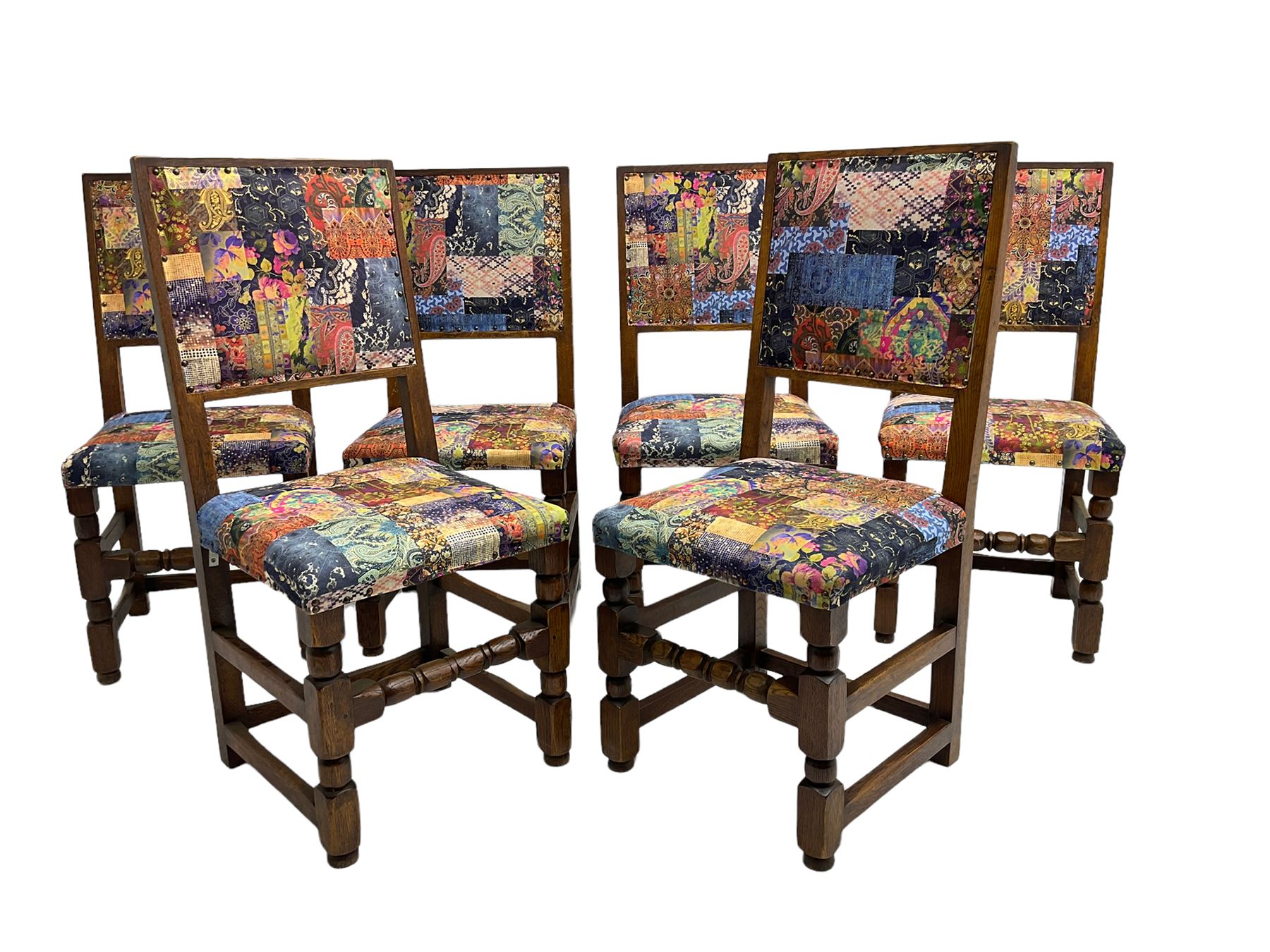 Set six oak high back dining chairs, upholstered in patchwork patterned fabric The Furnishings