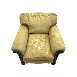 Early 20th century mahogany framed three-piece lounge suite - three-seat camelback sofa (W203cm, D105cm); pair of matching armchairs (W95cm, D96cm); upholstered in neutral foliate pattern fabric, carved with trailing leafy branches, ball and claw carved feet with brass castors 