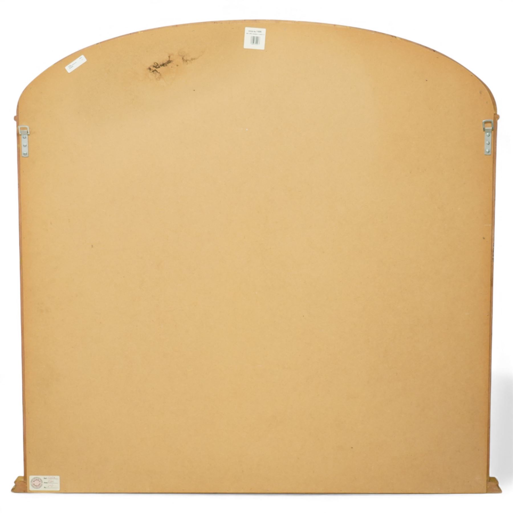 Contemporary large giltwood overmantel mirror, arched rectangular form with reeded moulded frame and stepped lower rail