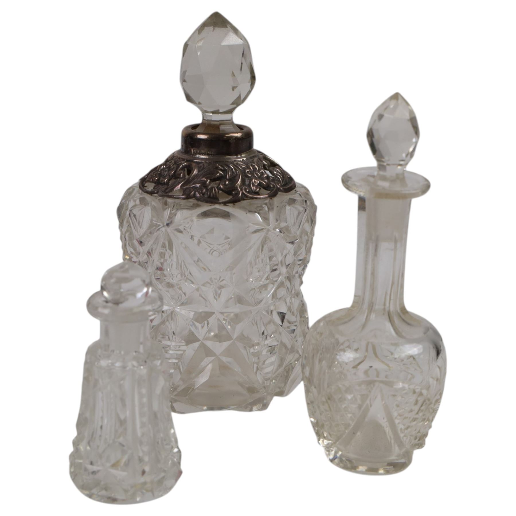 Silver mounted hand mirror, hallmarked together with silver mounted scent bottle and four other glass bottles