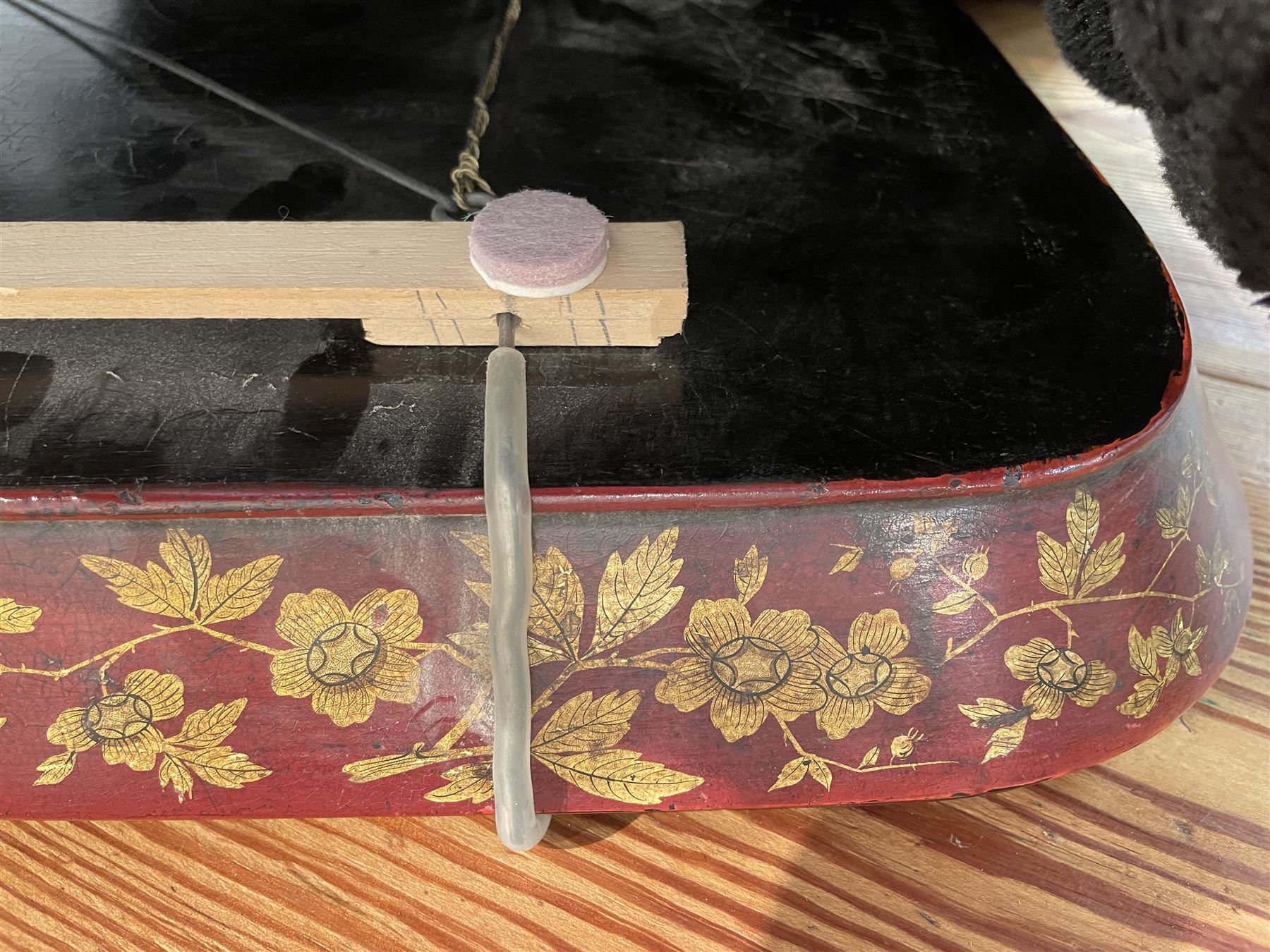 Early 19th century red lacquered papier-mâché tray by Clay of King Street Covent Garden, of rounded rectangular form, painted in gilt with large foliate sprays and butterflies, impressed verso CLAY KING ST COVENT GARDEN, W66.5cm D48.5cm