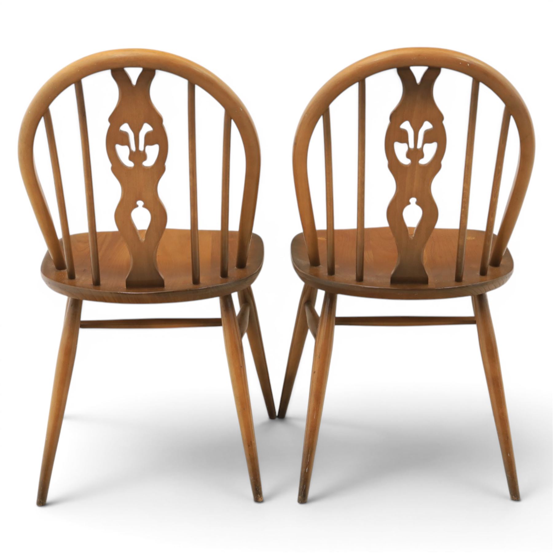 Ercol - Set of four dark elm 'Fleur De Lys' chairs