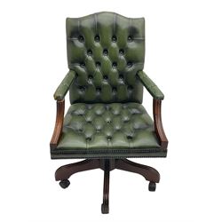 Georgian design swivel office desk chair, upholstered in buttoned green leather, on five spoke base with castors 